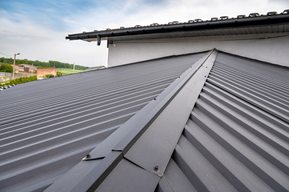 A close up image of the top and sides of a metal roof.